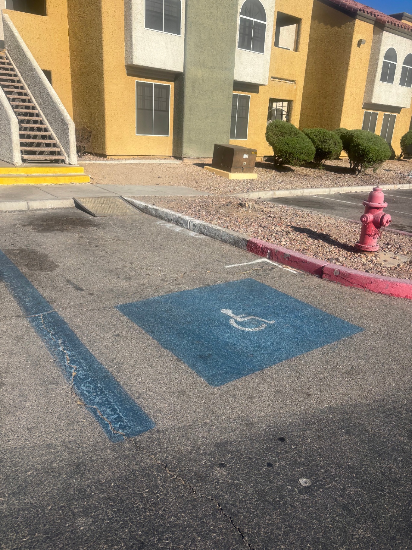 Apartment complex accessible parking with curb ramp